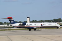 N933LR @ KSRQ - US Air Flight 2678 operated by Mesa (N933LR) taxis for departure at Sarasota-Bradenton International Airport - by Jim Donten