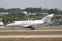 N885TM @ KSRQ - Raytheon Hawker 800 (N885TM) departs Sarasota-Bradenton International Airport enroute to Teterboro Airport - by Jim Donten