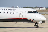 N933LR @ KSRQ - US Air Flight 2678 operated by Mesa (N933LR) prepares for flight at Sarasota-Bradenton International Airport - by Jim Donten