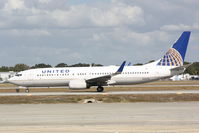 N24224 @ KSRQ - United Flight 1900 (N24224) arrives at Sarasota-Bradenton International Airport following a flight from Chicago-O'Hare International Airport - by Jim Donten