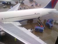 N140LL @ ATL - At ATL on a rainy day - by Mike Mickey