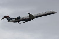 N933LR @ KSRQ - US Air Flight 2678 operated by Mesa (N933LR) departs Sarasota-Bradenton International Airport enroute to Charlotte/Douglas International Airport - by Jim Donten