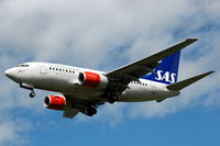 OY-KKS @ ESSA - SAS 737-600 approaching Stockholm Arlanda airport, Sweden. - by Henk van Capelle