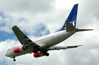 OY-KKG @ ESSA - SAS Boeing 737-600 approaching Stockholm Arlanda airport, Sweden. - by Henk van Capelle