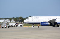 N605JB @ KSRQ - Jet Blue Airbus A320 (N605JB) pushes back from the gate at Sarasota-Bradenton International Airport - by Jim Donten