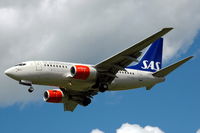 OY-KKH @ ESSA - SAS Boeing 737-600 approaching Stockholm Arlanda airport, Sweden. - by Henk van Capelle