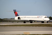 N957DN @ KSRQ - Delta Flight 1971 (N957DN) taxis at Sarasota-Bradenton International Airport - by Jim Donten