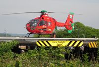 G-WASN - Off Airport. Swansea Airport based Wales Air Ambulance helicopter (Helimed 57) on the helipad at Morriston Hospital, Swansea, Wales, UK. - by Roger Winser