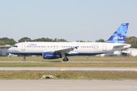 N760JB @ KSRQ - Jet Blue Airbus A320 (N760JB) departs Runway 32 at Sarasota-Bradenton International Airport - by Jim Donten