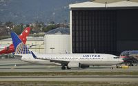 N36247 @ KLAX - Taxing to gate - by Todd Royer