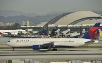 N130DL @ KLAX - Taxiing to gate - by Todd Royer