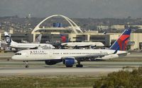 N648DL @ KLAX - Taxiing to gate - by Todd Royer
