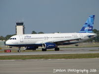 N715JB @ KSRQ - JetBlue Flight 1187 How's My Flying? Call 1-800-JetBlue (N715JB) arrives at Sarasota-Bradenton International Airport following a flight from Boston-Logan International Airport - by Donten Photography