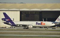 N591FE @ KLAX - Taxiing to parking - by Todd Royer