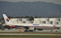 9M-MRE @ KLAX - Taxiing for departure - by Todd Royer