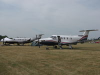 N695PC @ KOSH - In the camp grounds at EAA2012.N546PB in the back. - by steveowen