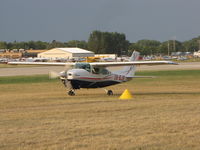 XB-BJR @ KOSH - taxing in the grass taxiway - by steveowen
