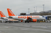 G-EZNC @ EGPH - Easyjet A319 on the international arrivals terminal having just arrived from Madrid - by Mike stanners