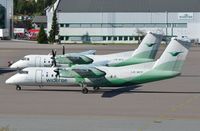 LN-WFP @ ENTO - Wideroe's Dash8 parks next to sistership - by FerryPNL