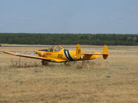 N93821 @ KSTE - not moved in awhile judging by the long grass - by steveowen