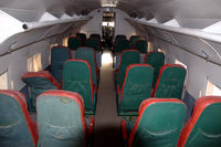 CS-TDA @ LPST - The passenger cabin of the Douglas C-47A Skytrain preserved in the Museu do Ar at Sintra Air Base in Portugal. Pity there is a broken seat. - by Henk van Capelle