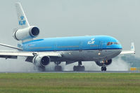 PH-KCC @ EHAM - KLM-Royal Dutch Airlines Mc Donnell Douglas MD11 landing in EHAM/AMS - by Janos Palvoelgyi