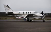 N200RE @ EGFH - Visiting Beech King Air basking in the rain. - by Roger Winser