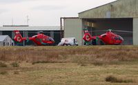 G-WASC @ EGFH - Welshpool Airport based Wales Air Ambulance helicopter Helimed 59 (on the left) joins resident Helimed 57 (G-WASN) at the South Wales air ambulance base on the day before the 12th anniversary of the Wales Air Ambulance Service being founded. - by Roger Winser