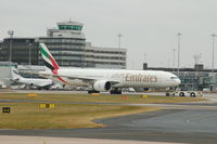 A6-EBJ @ EGCC - Emirates Boeing 777 being prepared for take off at Manchester Airport - by David Burrell