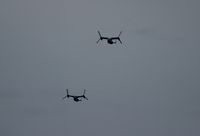 166726 - Mv-22B formation over Cocoa Beach with nearby storms