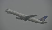 N577UA @ KLAX - Departing LAX on a foggy morning - by Todd Royer