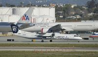 N433QX @ KLAX - Taxiing to gate - by Todd Royer