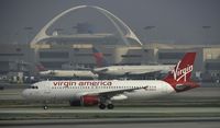 N842VA @ KLAX - Taxiing to gate on a foggy morning - by Todd Royer