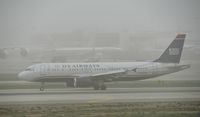 N626AW @ KLAX - Taxiing to gate on a foggy morning - by Todd Royer
