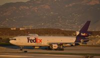 N522FE @ KLAX - Taxiing to parking at LAX - by Todd Royer