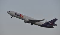 N590FE @ KLAX - Departing LAX - by Todd Royer