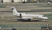 N63HS @ KLAX - Taxiing to parking - by Todd Royer