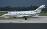 N107LT @ ORL - BAE HS700A with arriving storms - by Florida Metal