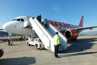 G-EZTM @ LSGG - disembarking after our flight from Liverpool - by Chris Hall