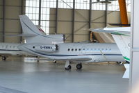 G-RMMA @ LSGG - Execujet (UK) Ltd Falcon 900EX in the Jet Aviation hangar - by Chris Hall
