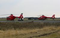 G-WASC @ EGFH - Wales Air Ambulance helicopters G-WASN (Helimed 57) and G-WASC (Helimed 59) on the apron at the South Wales Air Ambulance base at Swansea Airport. - by Roger Winser