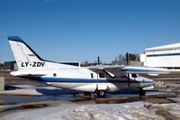 LY-ZDV @ ESKN - Mu-2 parked between snow patches at Nyköping Skavsta airport, Sweden. - by Henk van Capelle