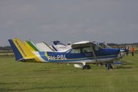 PH-PBL @ EHTX - This Cessna is in use by Flying Focus as a photoplane. It was at the 2012 Texel Airshow