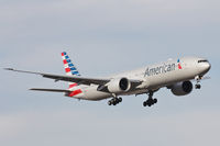 N718AN @ DFW - New American Airlines livery 777-300 landing at DFW Airport.