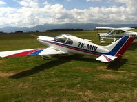 ZK-MIV @ NZMA - Sat on grass at Matamata. Loads of hangars but nothing to be seen. - by magnaman