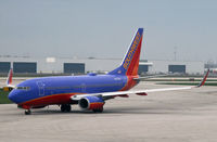 N247WN @ KCMH - A Southwest 737-700 taxies in at Port Columbus International. - by Daniel L. Berek
