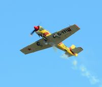 G-YFUT @ EGFH - Yak-52 putting on smoke. - by Roger Winser