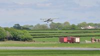 G-BAYO @ EGFE - Resident Cessna 150 operated by FlyWales departing Runway 22. - by Roger Winser