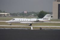 N650LR @ ORL - Lear 35A with thunderstorm