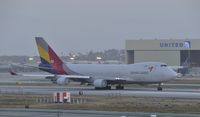 HL7419 @ KLAX - Early morning reverse departure from LAX - by Todd Royer